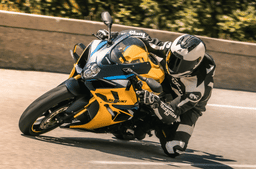 Suzuki GSX-R1000R 40th Anniversary Edition in yellow cornering shot from left side